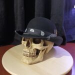 Black custom bowler hat with paisley bandana and piercing details - Outlaw Ritual
