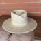 Professional handcrafted raffia straw hat with a signature pinch crown and a 10cm flat brim.